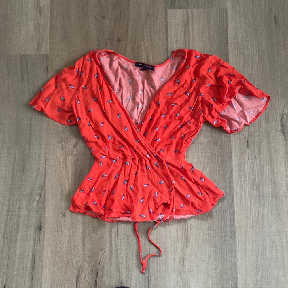 Red blouse with small flowers- fits like a peplum shirt
